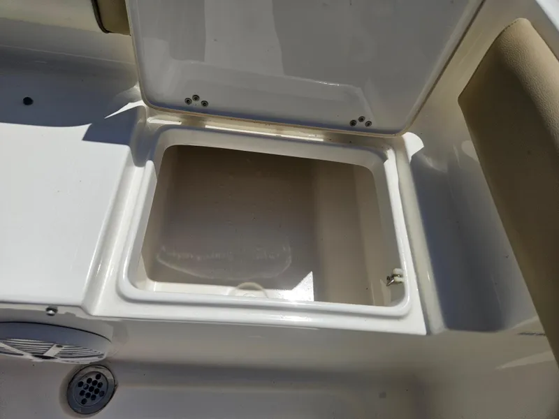 Slide: The Image of Open storage compartment on 2018 Key West 219 FS boat. - 16