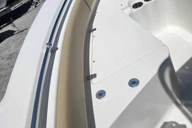 Slide: The Image of 2018 Key West 219 FS boat interior with cup holders and seating area. - 23