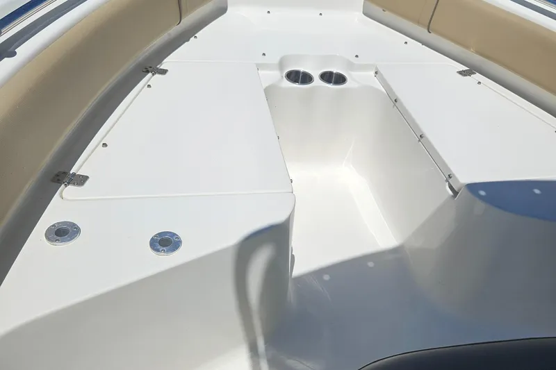 Slide: The Image of 2018 Key West 219 FS boat interior with seating and storage compartments. - 24