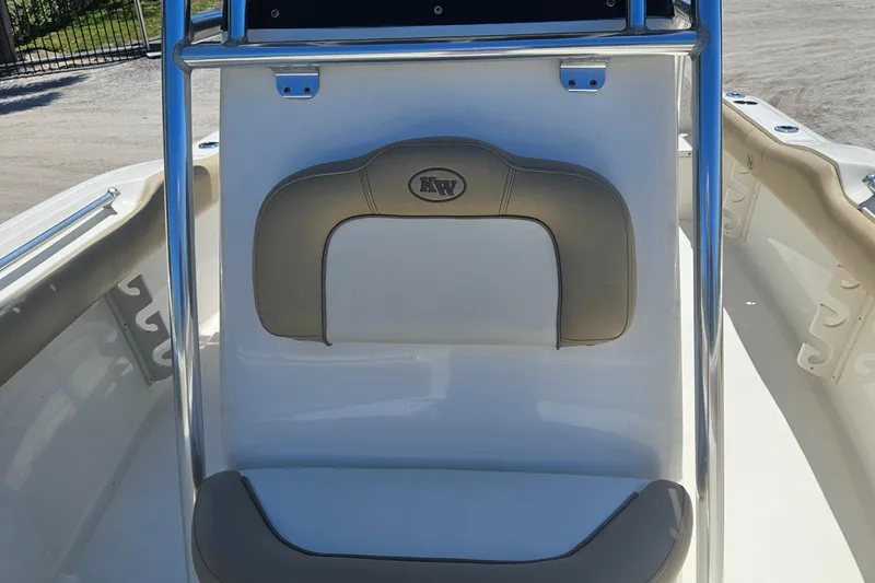 Slide: The Image of 2018 Key West 219 FS boat interior with cushioned seating and stainless steel frame. - 26