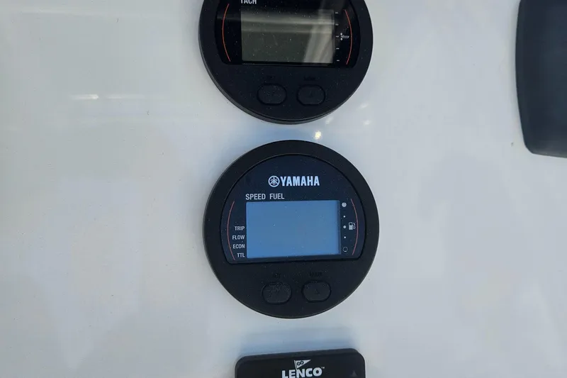 Slide: The Image of Yamaha speed and fuel gauge on 2018 Key West 219 FS boat dashboard. - 29