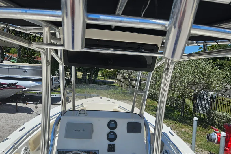 Slide: The Image of 2018 Key West 219 FS boat console with navigation equipment and canopy. - 30
