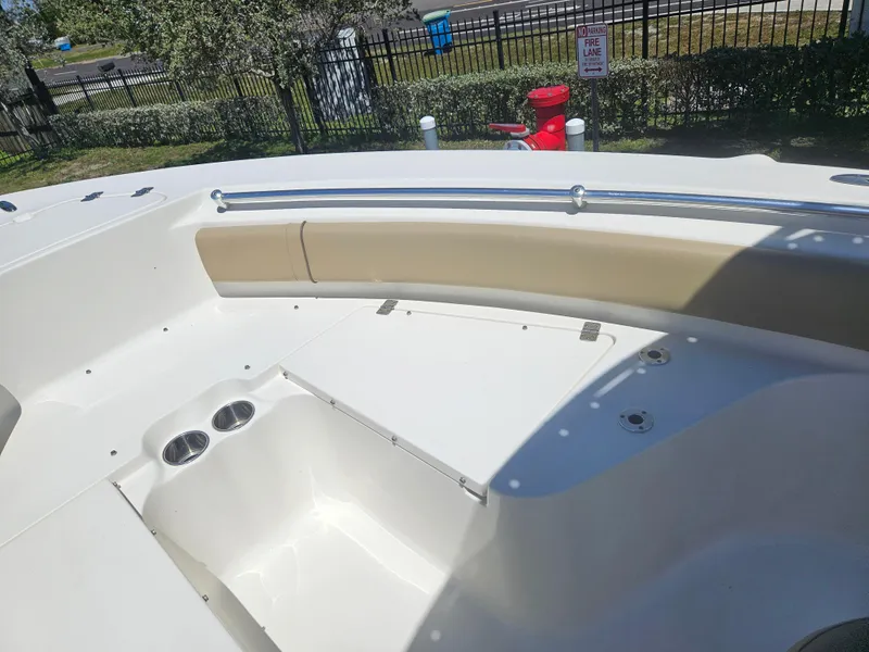 Slide: The Image of 2018 Key West 219 FS boat interior with seating and cup holders. - 6