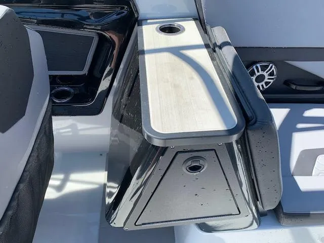 Slide: The Image of 2025 Yamaha Boats 255XD interior detail with sleek black and white design. - 11