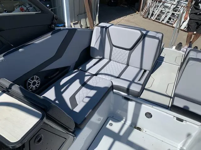 Slide: The Image of 2025 Yamaha Boats 255XD interior with gray seating and modern design. - 17