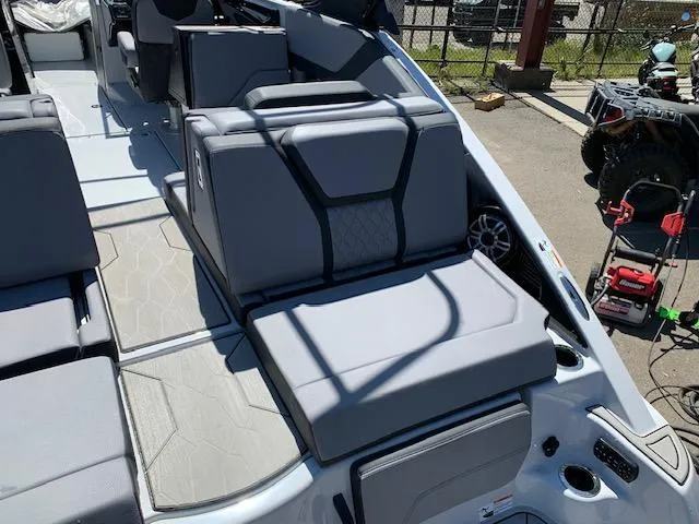 Slide: The Image of 2025 Yamaha Boats 255XD interior with gray seating and modern design. - 19