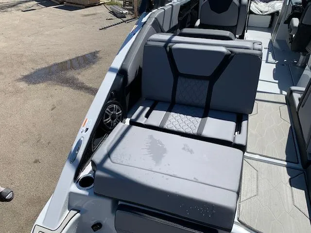 Slide: The Image of 2025 Yamaha Boats 255XD interior with gray seating and modern design. - 20