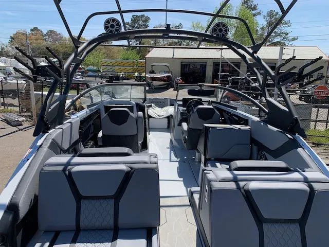 Slide: The Image of 2025 Yamaha Boats 255XD interior with modern seating and sleek design. - 26