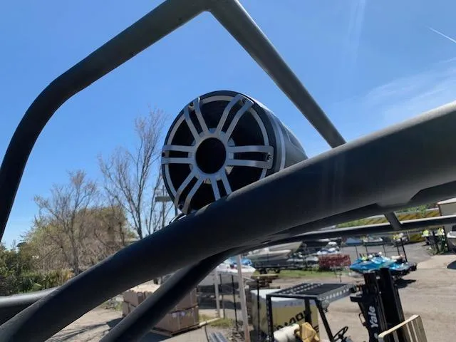 Slide: The Image of Speaker mounted on Yamaha Boats 255XD, 2025 model, with clear blue sky background. - 6