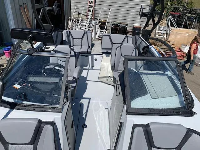 Slide: The Image of 2025 Yamaha Boats 255XD interior with modern seating and dual windshields. - 8