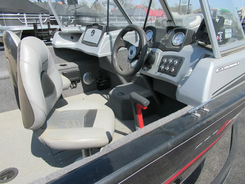 Slide: The Image of 2019 Tracker Pro V175 Guide boat interior with steering wheel and control panel. - 3
