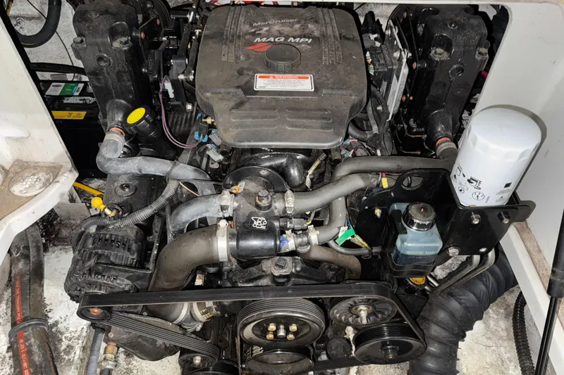 Slide: The Image of Engine of a 2005 Crownline 240 EX boat, featuring a MAG MPI system. - 18