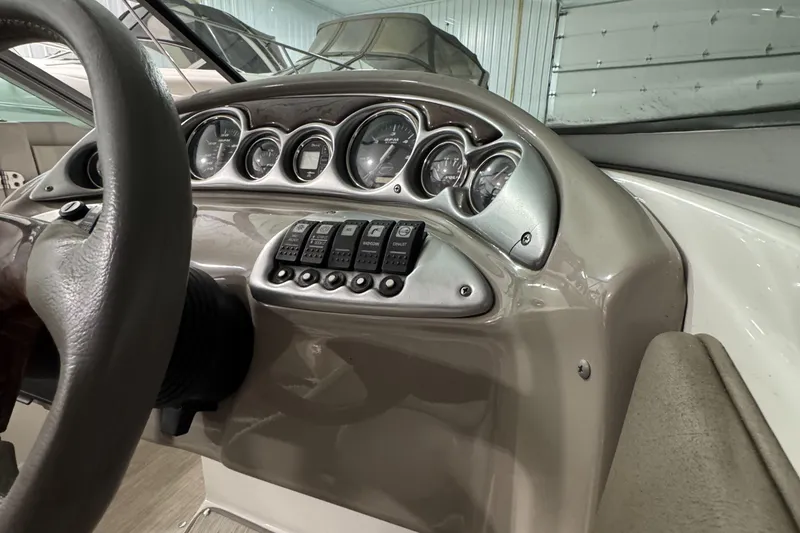 Slide: The Image of Dashboard of 2005 Crownline 240 EX boat with gauges and control switches. - 6