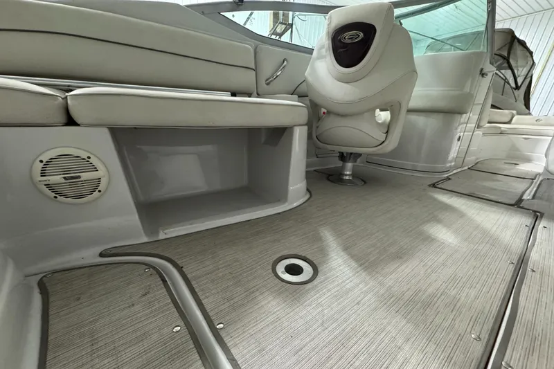Slide: The Image of Interior of 2005 Crownline 240 EX boat with seating and carpeted flooring. - 8