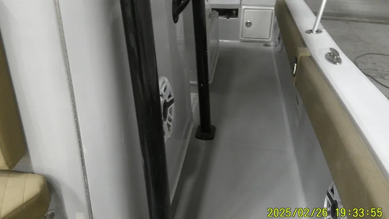 Slide: The Image of 2024 Ranger 2510 Bay boat interior with seating and storage compartments. - 13