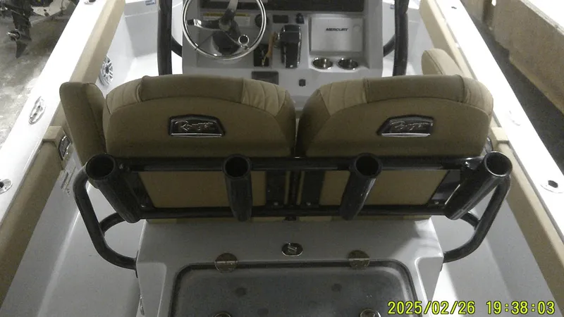 Slide: The Image of 2024 Ranger 2510 Bay boat interior with dual seats and steering console. - 4