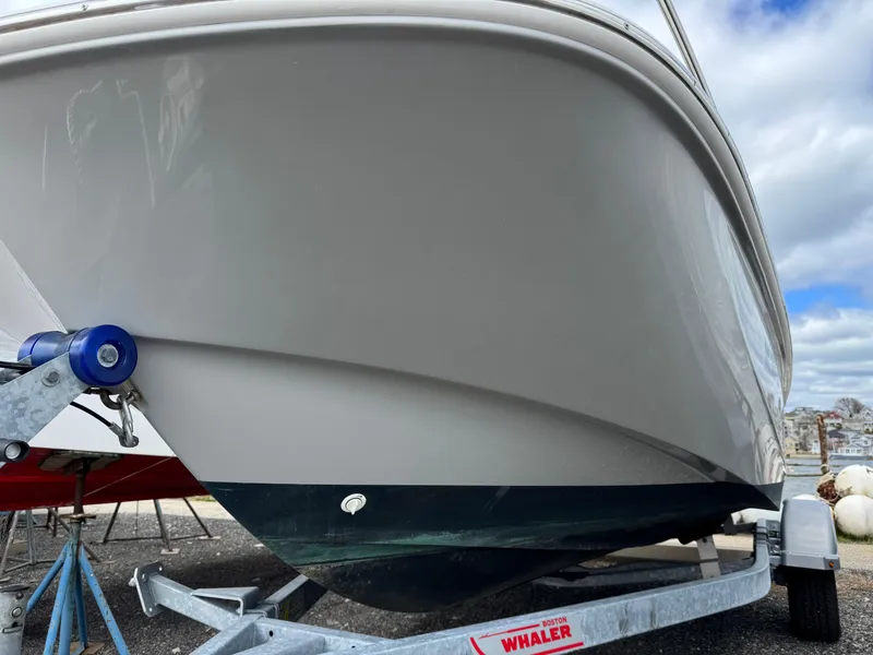Slide: The Image of 2023 Boston Whaler 170 Montauk boat on trailer, viewed from the front. - 19