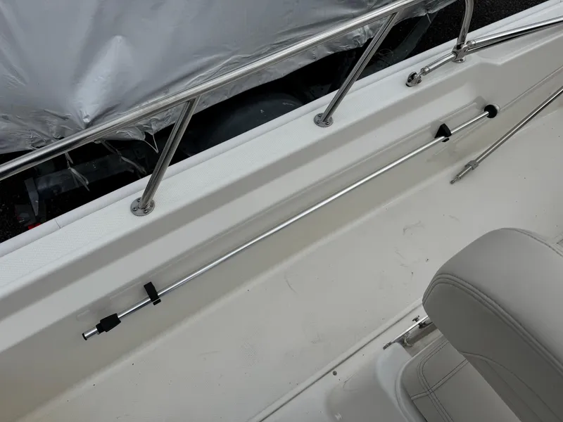 Slide: The Image of 2023 Boston Whaler 170 Montauk interior with stainless steel railing and seating detail. - 21