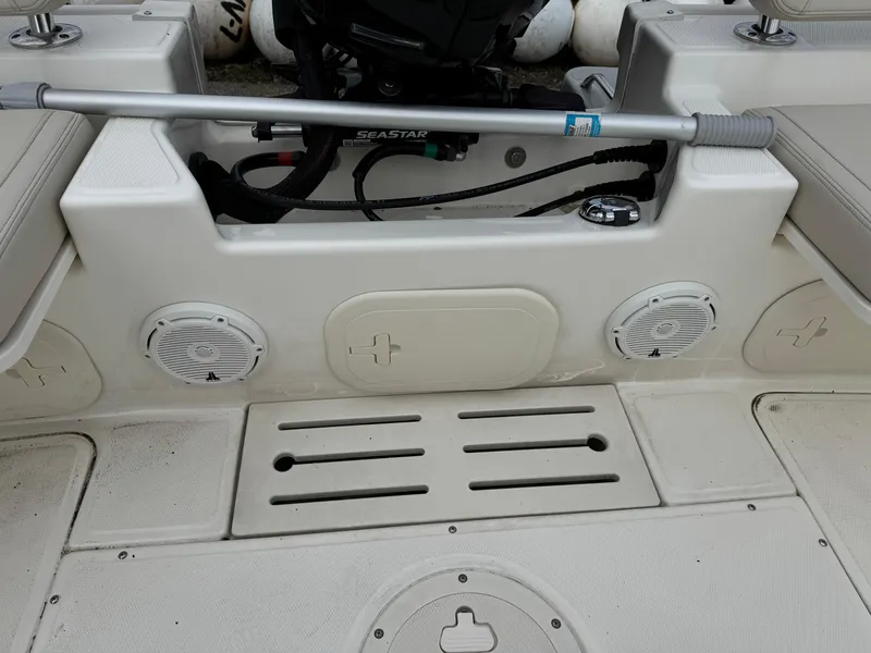 Slide: The Image of 2023 Boston Whaler 170 Montauk boat interior with speakers and storage compartments. - 24