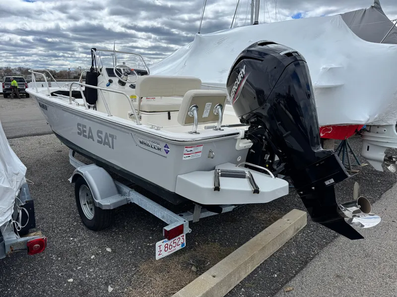 Slide: The Image of 2023 Boston Whaler 170 Montauk boat on trailer, featuring Mercury outboard motor. - 5