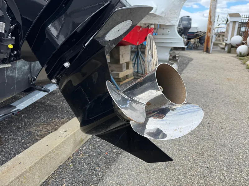 Slide: The Image of Outboard motor propeller of a 2023 Boston Whaler 170 Montauk boat, displayed outdoors. - 9