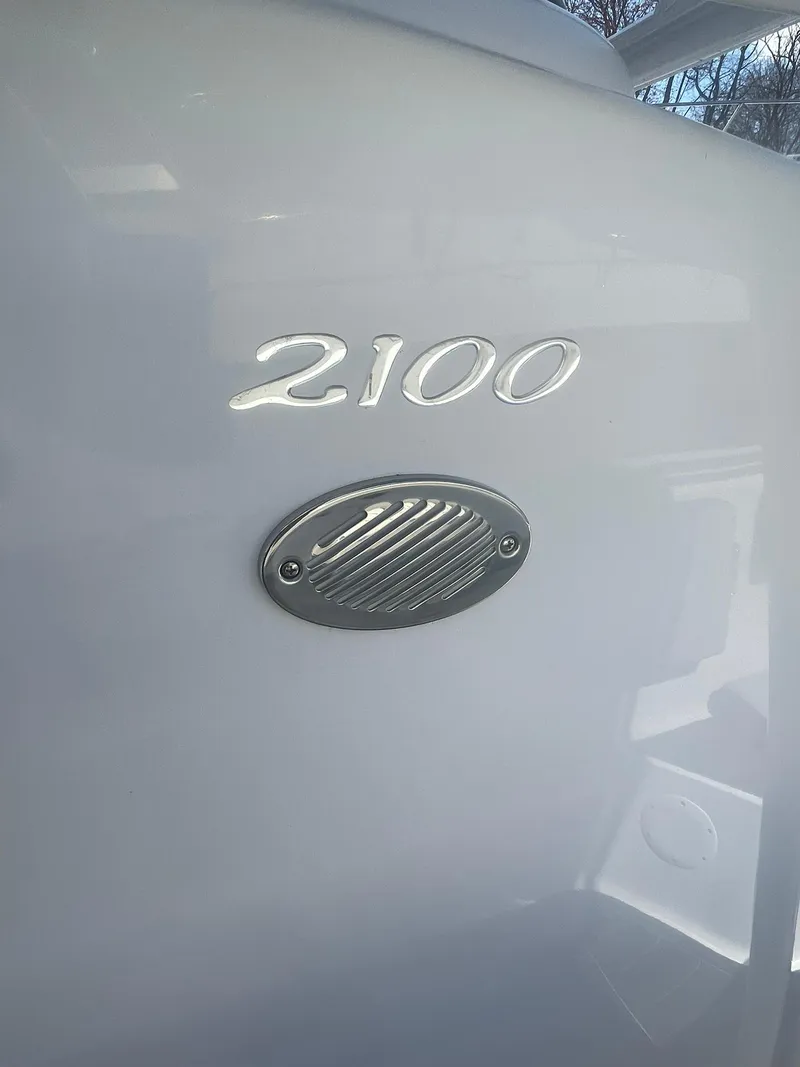Slide: The Image of 2022 Aquasport 2100 CC boat detail with model number and vent. - 15