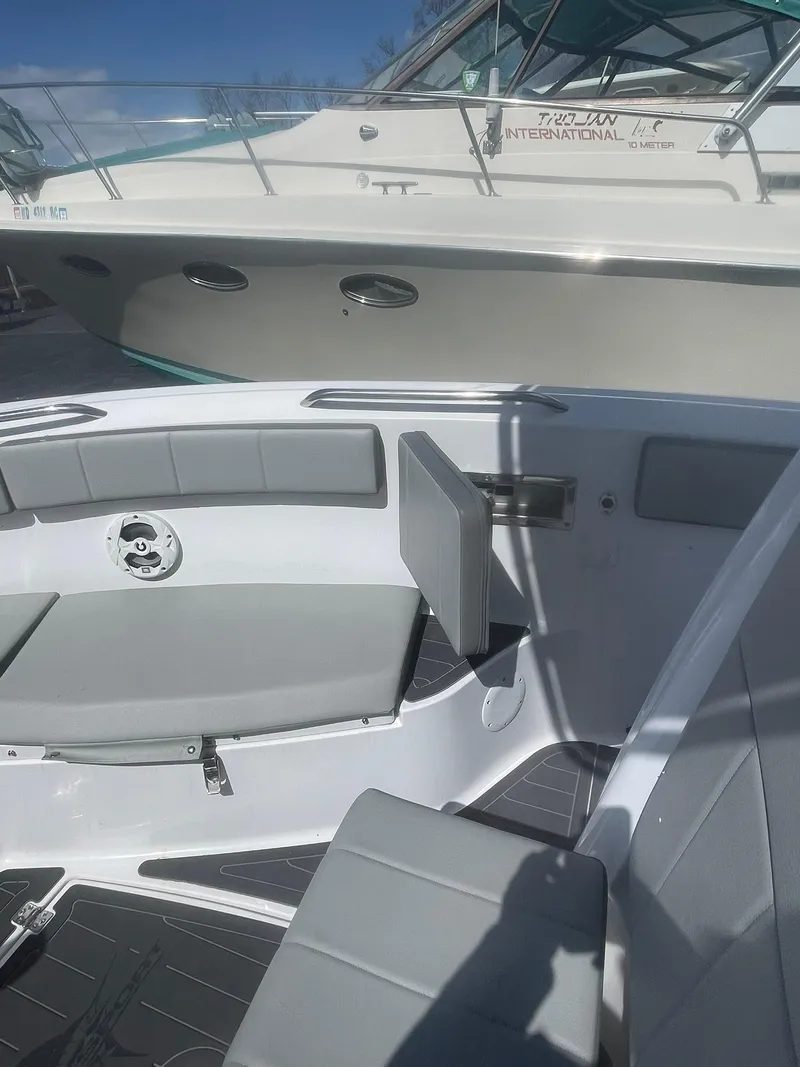 Slide: The Image of 2022 Aquasport 2100 CC boat interior with seating and modern design. - 22