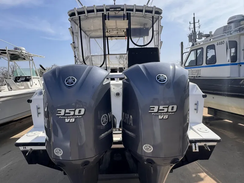 Slide: The Image of 1998 Contender 35 Express Side Console with twin Yamaha 350 V8 outboard engines. - 10