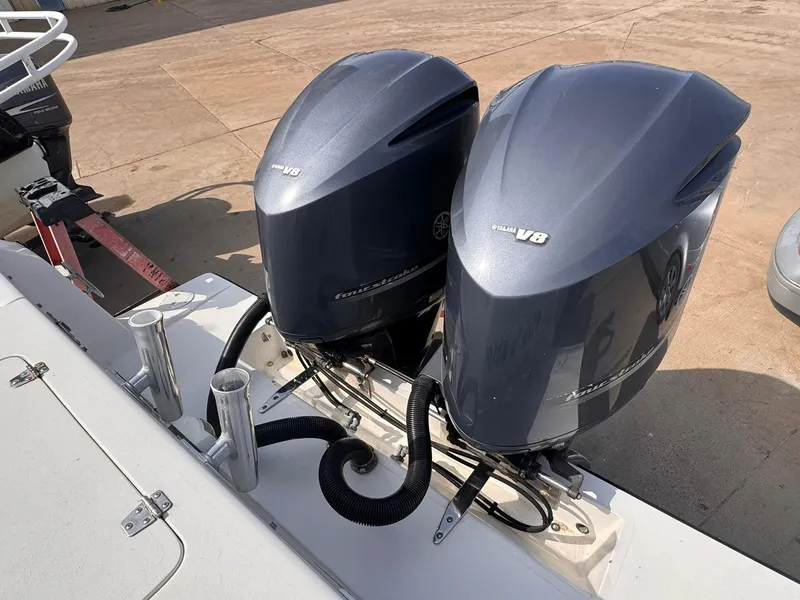Slide: The Image of Twin Yamaha V8 outboard engines on a 1998 Contender 35 Express Side Console boat. - 11