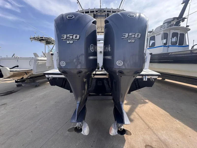 Slide: The Image of Twin Yamaha 350 V8 outboard engines on a 1998 Contender 35 Express Side Console boat. - 12