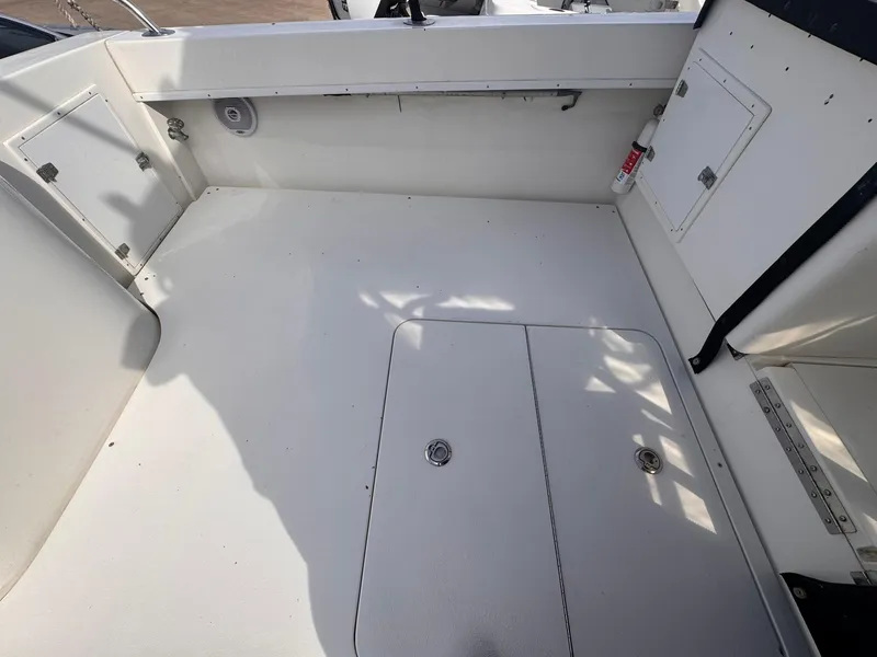 Slide: The Image of 1998 Contender 35 Express Side Console boat interior with storage compartments. - 21