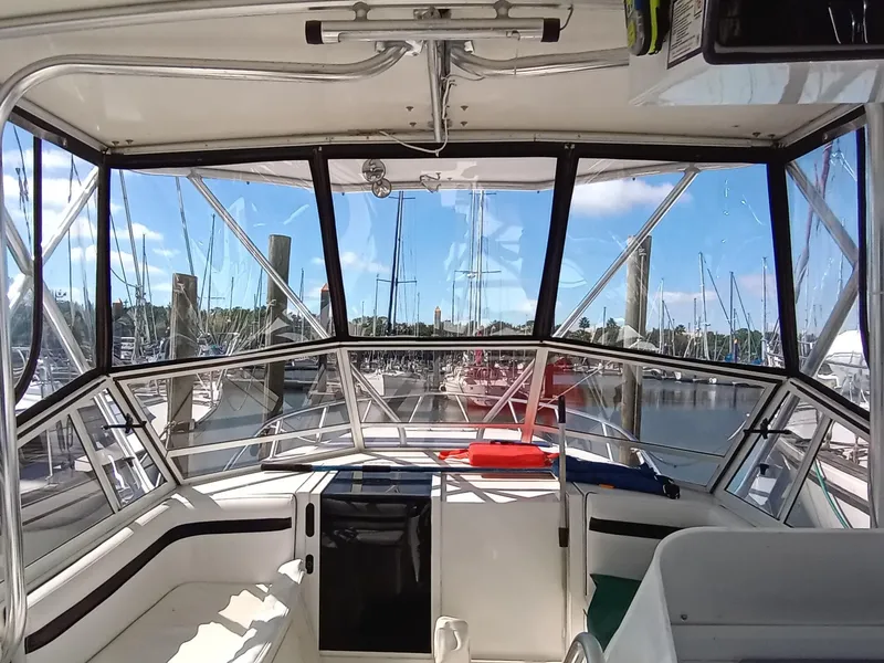 Slide: The Image of 1998 Contender 35 Express Side Console boat interior with marina view. - 4