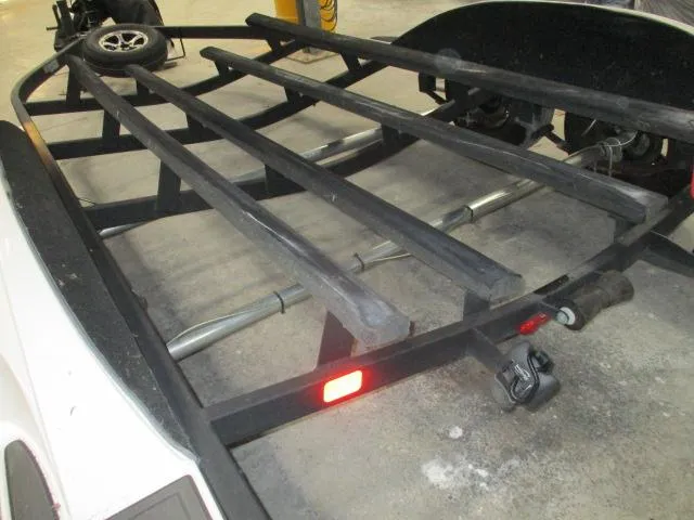 Slide: The Image of 2024 Nitro Z20 boat trailer with black frame and red reflector. - 10