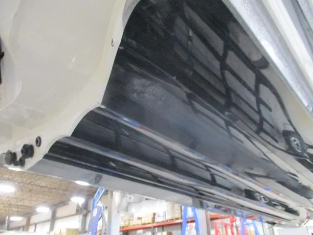 Slide: The Image of 2024 Nitro Z20 boat hull in a workshop setting. - 12