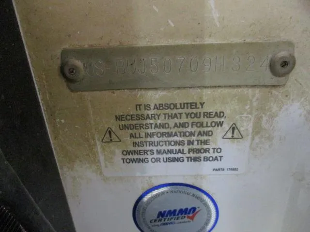 Slide: The Image of 2024 Nitro Z20 boat warning label and NMMA certification sticker. - 13