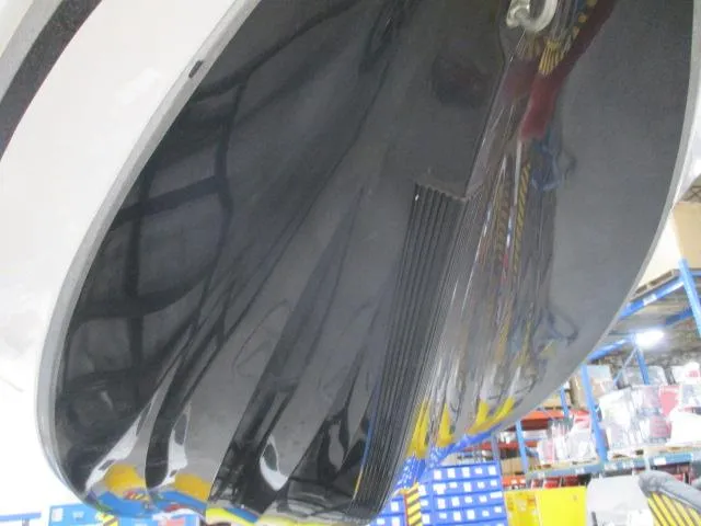 Slide: The Image of 2024 Nitro Z20 boat hull in a workshop setting. - 14