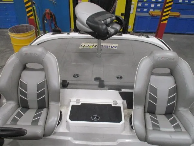 Slide: The Image of 2024 Nitro Z20 boat interior with gray seats and fishing platform. - 4