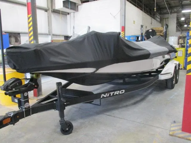 Slide: The Image of 2024 Nitro Z20 boat covered in a warehouse setting. - 7