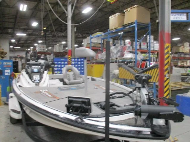 Slide: The Image of 2024 Nitro Z20 boat in a warehouse setting, surrounded by industrial equipment. - 8
