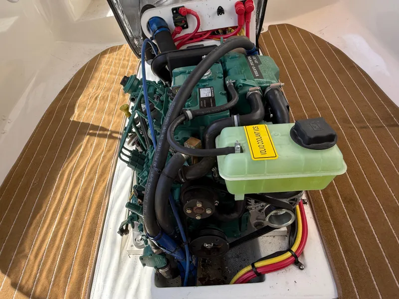 Slide: The Image of Engine of 2016 Ranger Tugs R-21 EC boat, showcasing detailed components and wiring. - 12