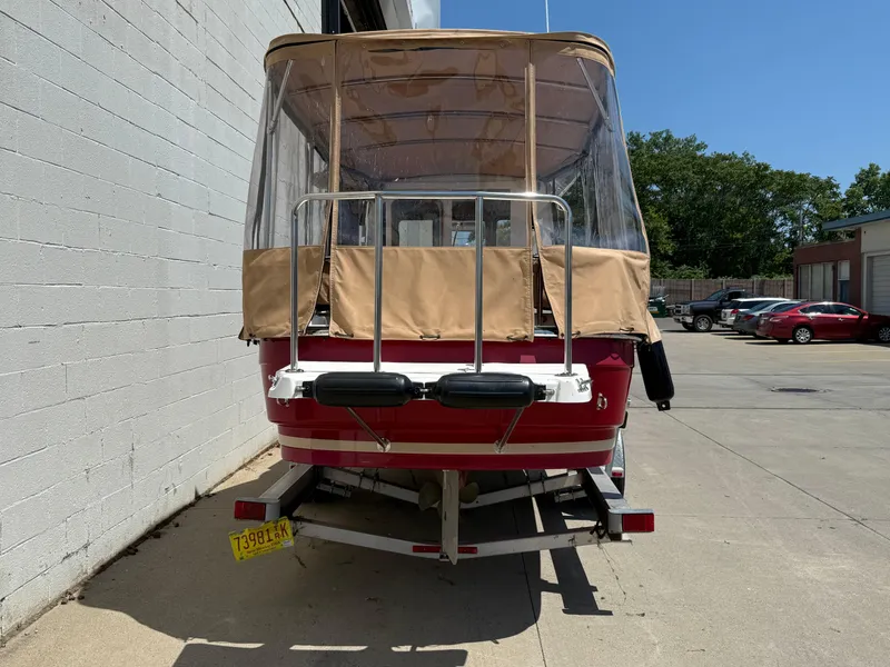 Slide: The Image of 2016 Ranger Tugs R-21 EC boat on trailer, parked outdoors. - 22