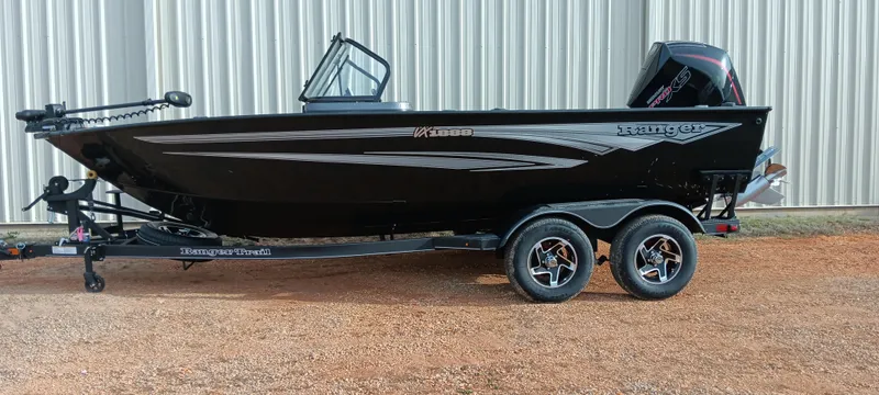 Slide: The Image of 2024 Ranger VX1888 WT boat on trailer, black exterior, parked outdoors. - 1