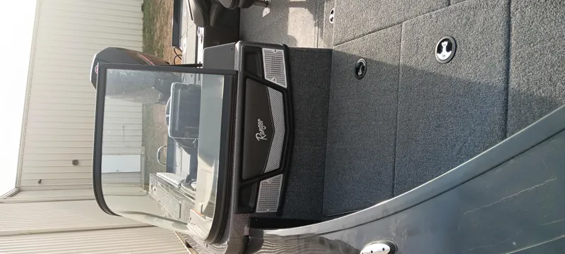 Slide: The Image of 2024 Ranger VX1888 WT boat interior with windshield and carpeted deck. - 14