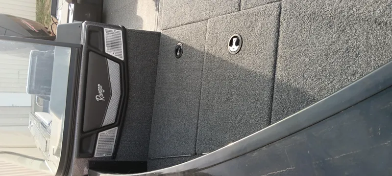 Slide: The Image of 2024 Ranger VX1888 WT boat interior with carpeted flooring and storage compartments. - 17