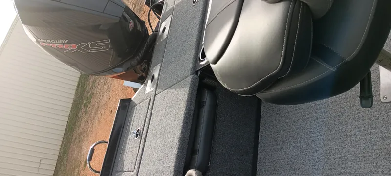 Slide: The Image of 2024 Ranger VX1888 WT boat interior with Mercury engine and seating. - 18