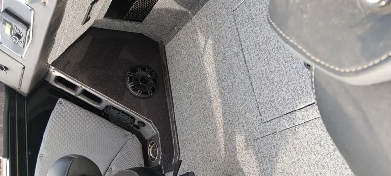 Slide: The Image of 2024 Ranger VX1888 WT interior with textured flooring and speaker system. - 21