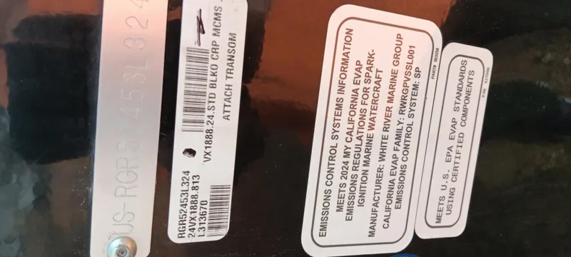 Slide: The Image of 2024 Ranger VX1888 WT emission control and compliance labels on vehicle component. - 26