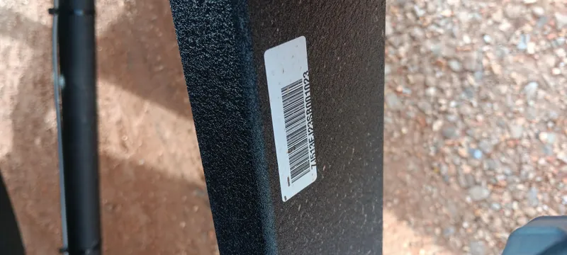 Slide: The Image of 2024 Ranger VX1888 WT with barcode on textured surface, gravel background. - 27