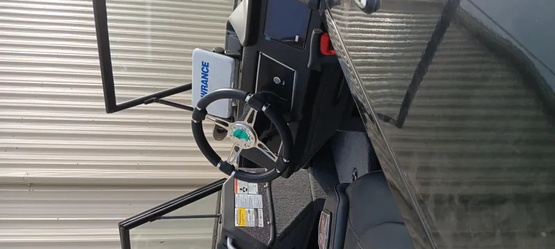 Slide: The Image of 2024 Ranger VX1888 WT boat interior with steering wheel and control panel. - 5