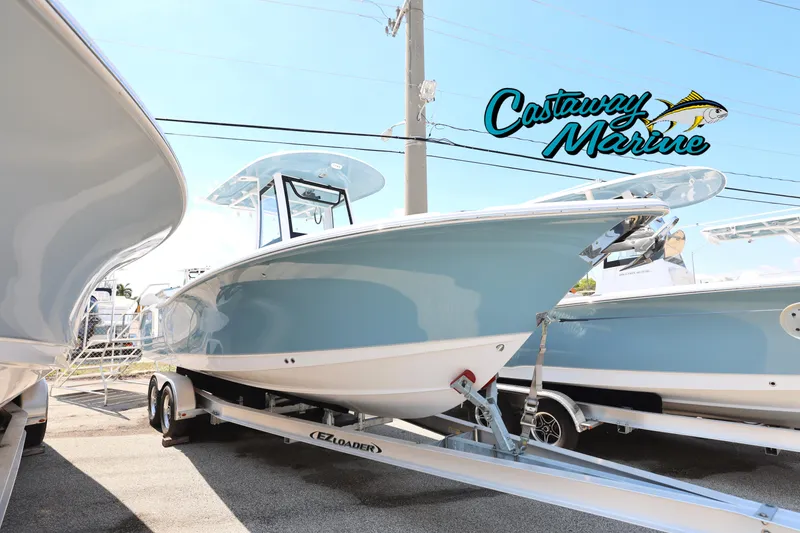 Slide: The Image of 2025 Sea Hunt Ultra 265 SE boat on trailer at Castaway Marine dealership. - 0